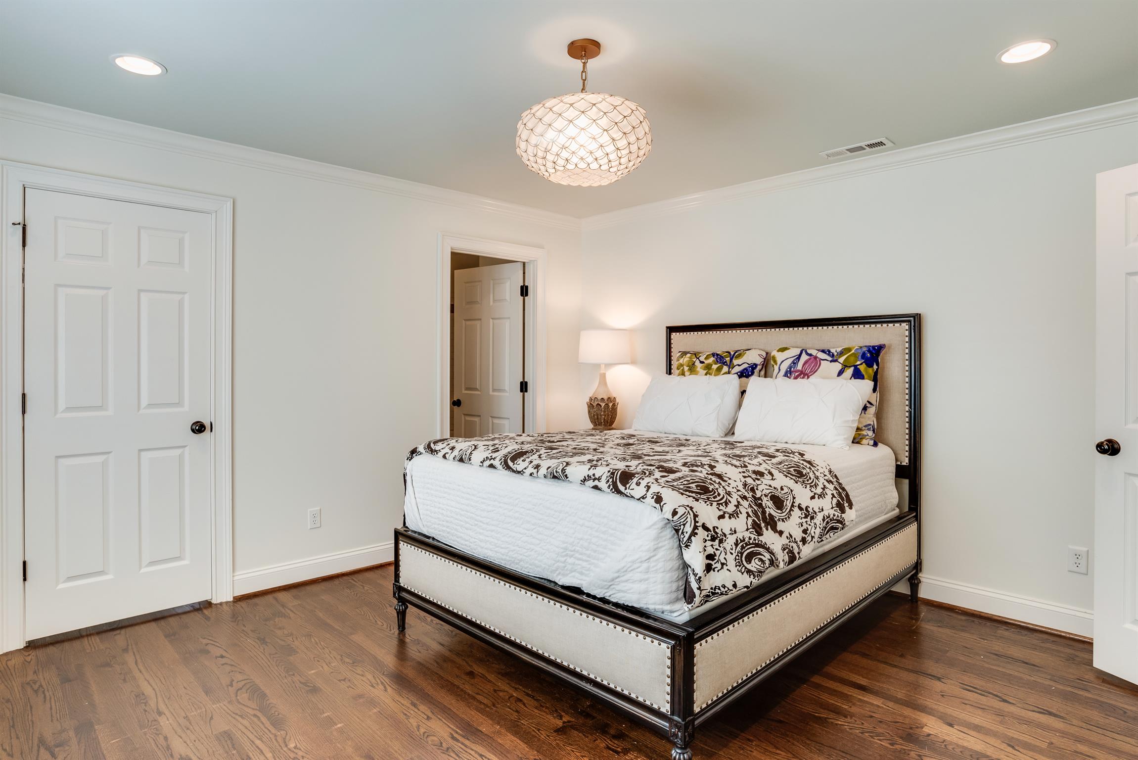 3904 Valley Road Nashville, TN 37205 - Photo 16 of 25 a bedroom with a bed and wooden floor
