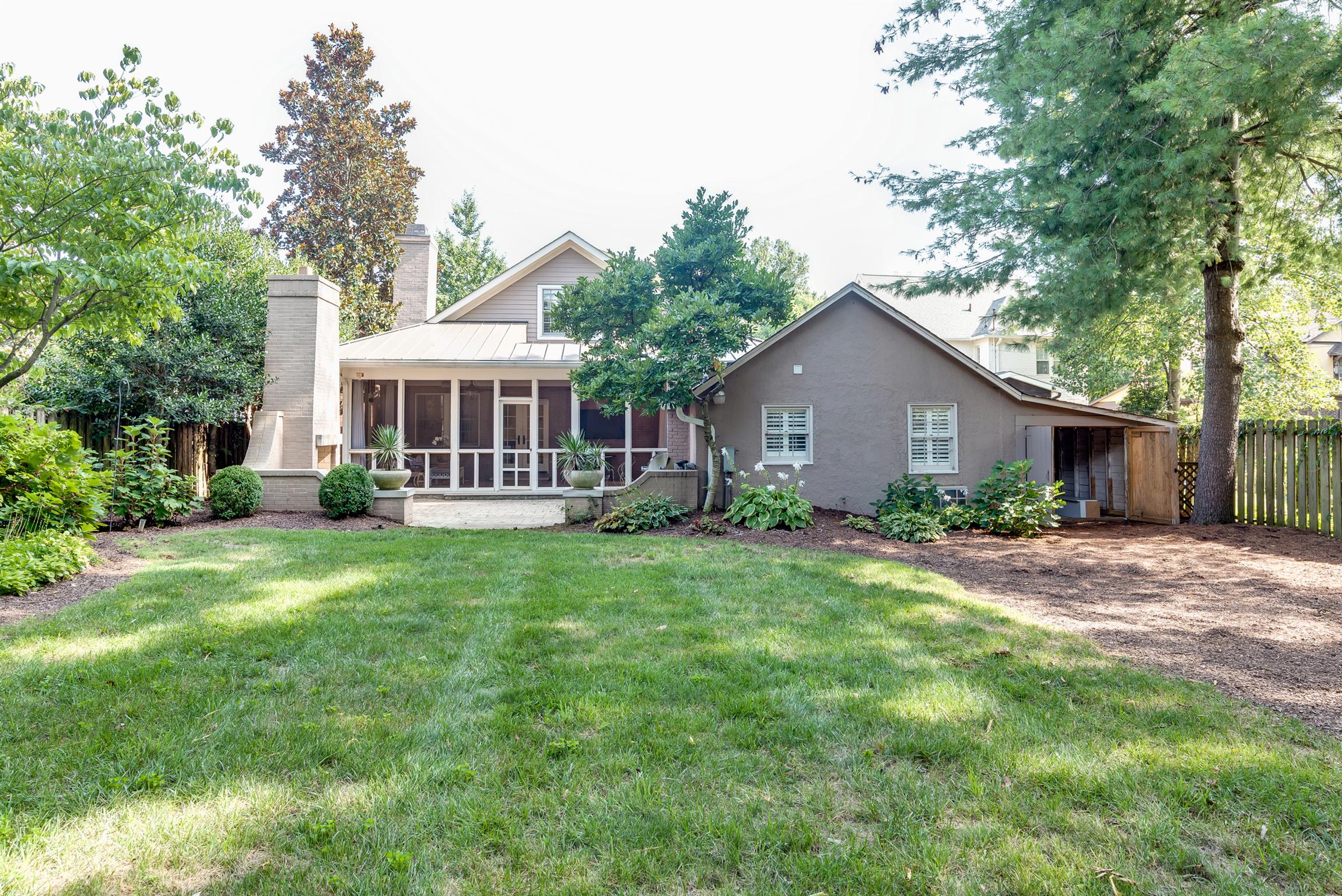 3904 Valley Road Nashville, TN 37205 - Photo 24 of 25 a front view of a house with a garden and porch