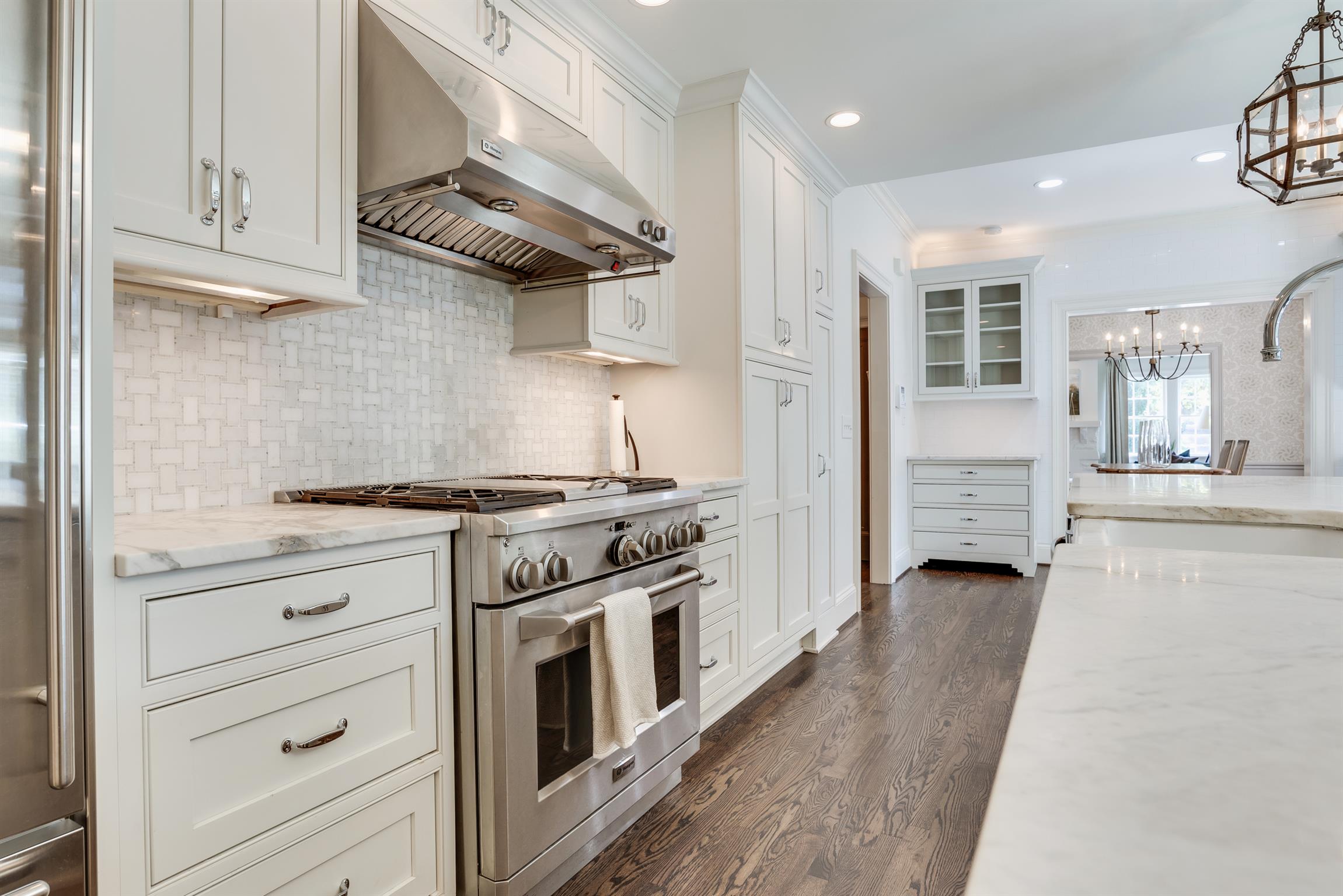 3904 Valley Road Nashville, TN 37205 - Photo 6 of 25 a kitchen with stainless steel appliances granite countertop a stove and a sink