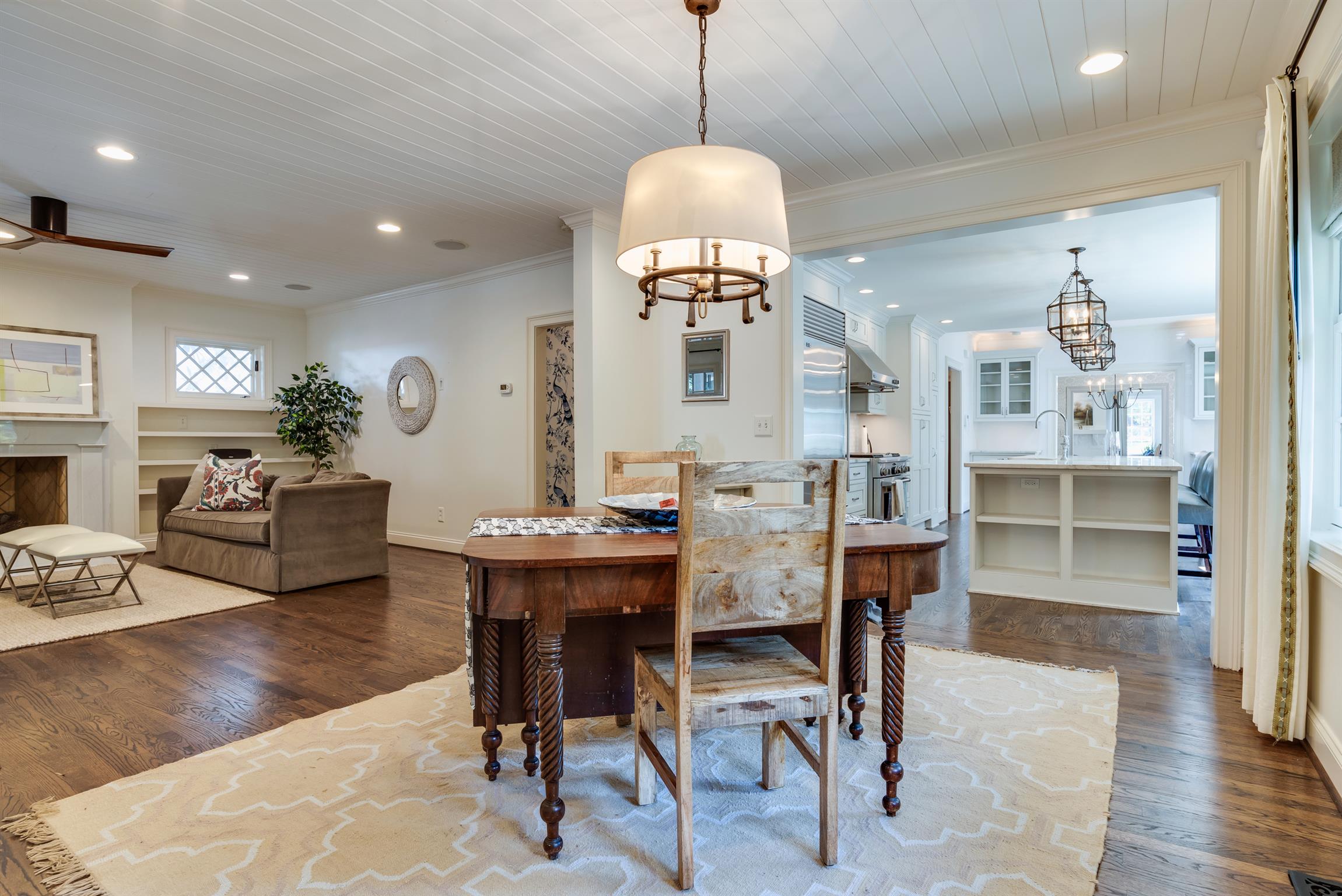 3904 Valley Road Nashville, TN 37205 - Photo 7 of 25 a view of a dining room and livingroom with furniture wooden floor a rug a painting and a chandelier