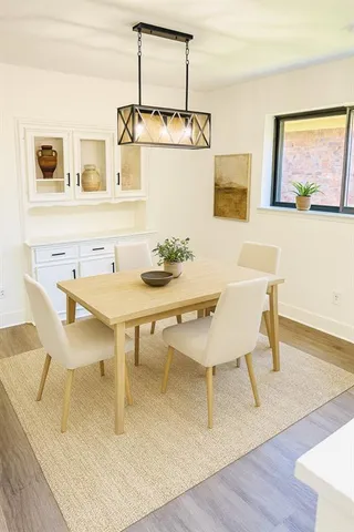 a view of a dining room with furniture and window