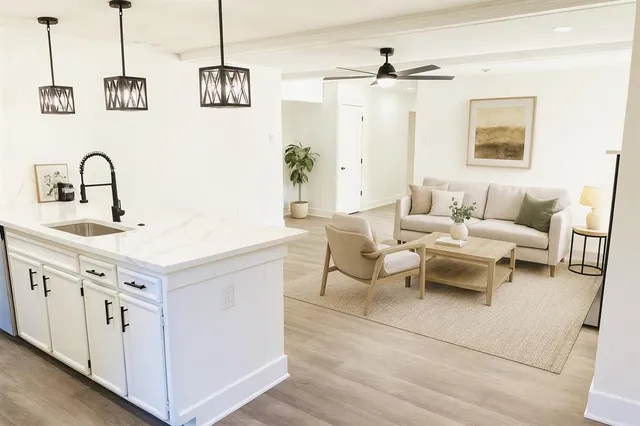 a view of a livingroom with a fireplace and window