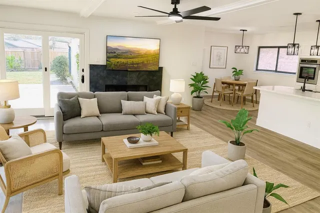 a bedroom with a bed and wall painting