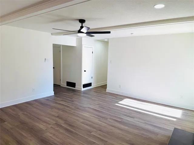 a kitchen with kitchen island a counter top space a sink stainless steel appliances and cabinets