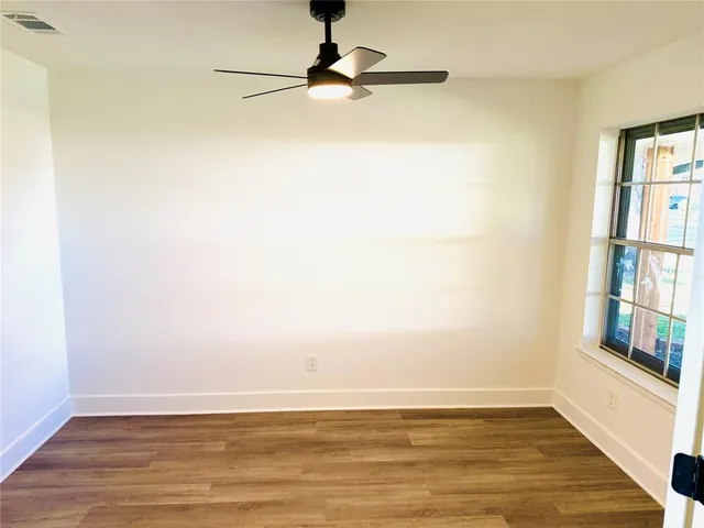 a view of a dining room with furniture and window
