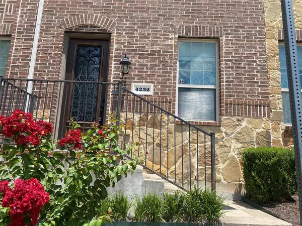 a front view of a house with an outdoor space