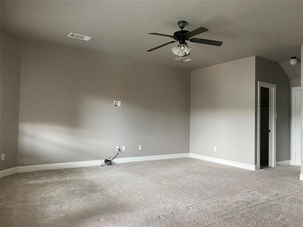 4232 Charles Road Carrollton, TX 75010 - Photo 18 of 21 a view of a livingroom with a ceiling fan