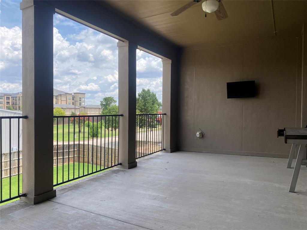 4232 Charles Road Carrollton, TX 75010 - Photo 20 of 21 a view of a room with sliding door and wooden floor