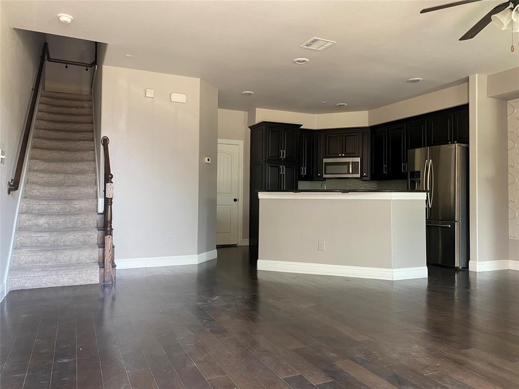 4232 Charles Road Carrollton, TX 75010 - Photo 5 of 21 a view of kitchen with stainless steel appliances cabinets and wooden floor