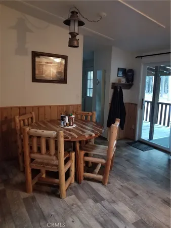 a view of a workspace with furniture and window