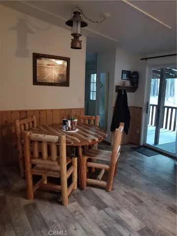 a view of a workspace with furniture and window