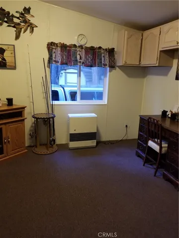 a bedroom with furniture and a bed