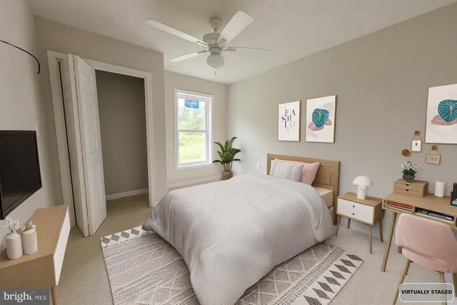 a bedroom with a large bed and a window