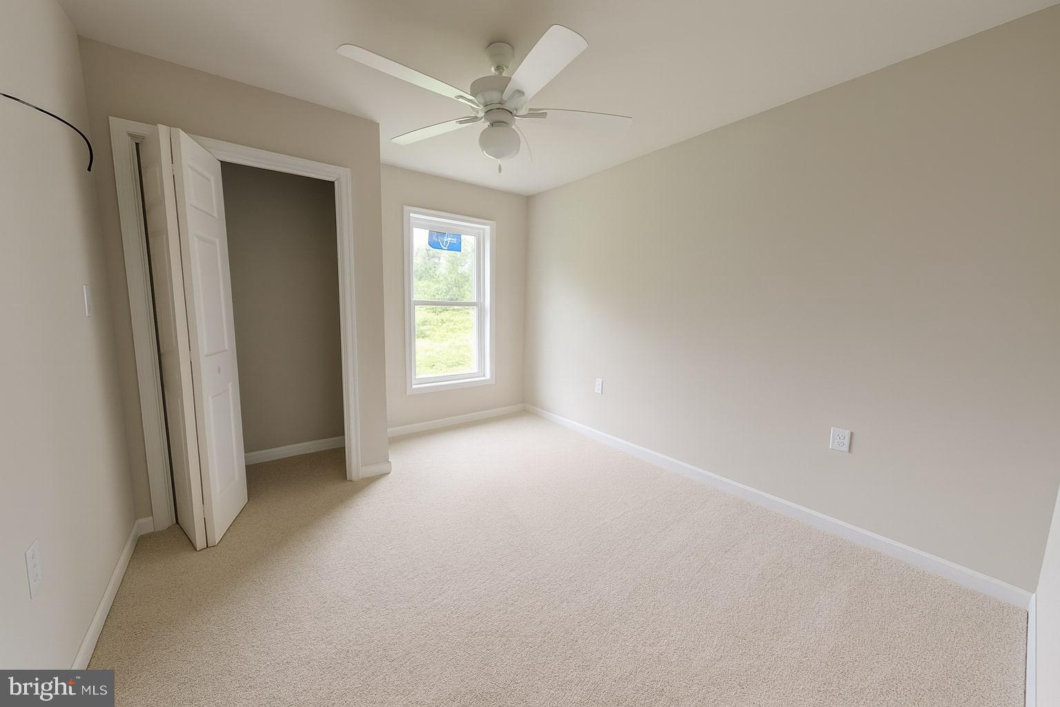 30568 Skipjack Circle, Unit 43 Princess Anne, MD 21853 - Photo 12 of 15 an empty room with windows and fan