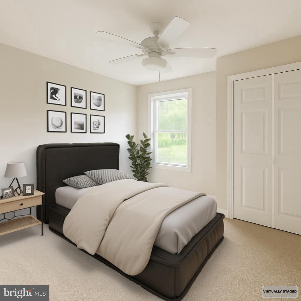 30568 Skipjack Circle, Unit 43 Princess Anne, MD 21853 - Photo 13 of 15 a bedroom with a bed and a window