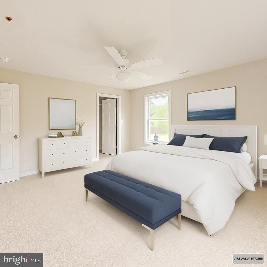 30568 Skipjack Circle, Unit 43 Princess Anne, MD 21853 - Photo 8 of 15 a spacious bedroom with a bed and a cabinets
