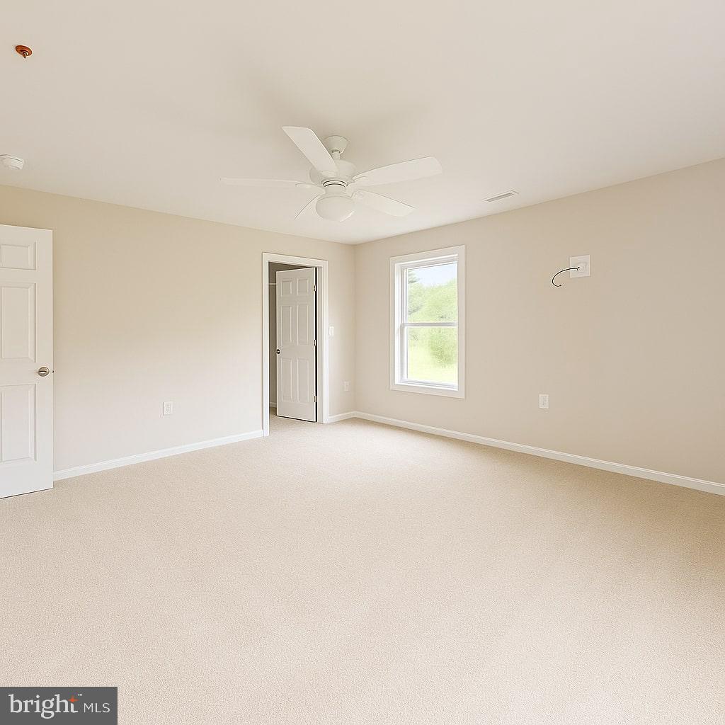 30568 Skipjack Circle, Unit 43 Princess Anne, MD 21853 - Photo 9 of 15 an empty room with windows and closet