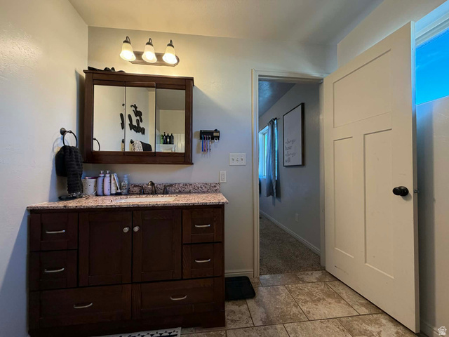 2095 West 4100 North Spring Glen, UT 84526 - Photo 13 of 35 Bathroom with vanity and baseboards