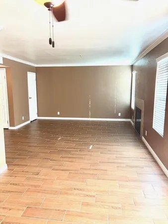 a view of a kitchen with kitchen island and wooden floor