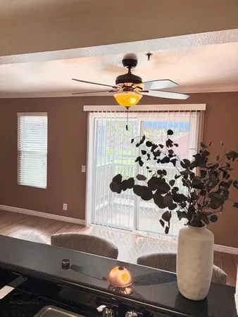 a bathroom with a granite countertop sink toilet a mirror and shower