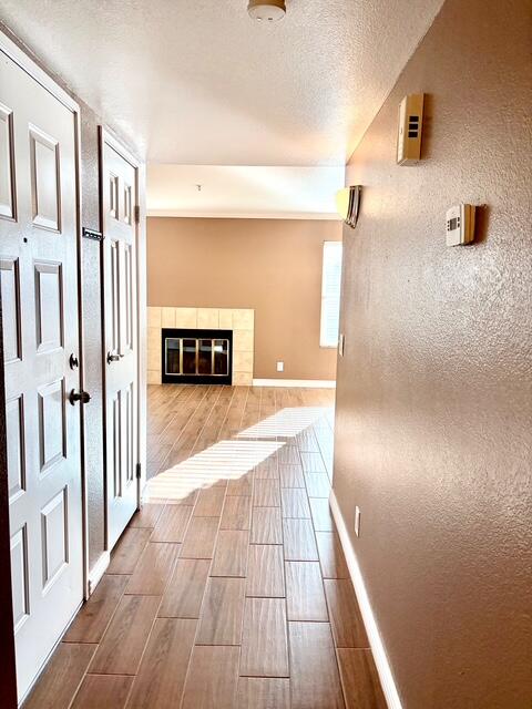 43376 Cook Street, Unit 88 Palm Desert, CA 92211 - Photo 16 of 38 a view of a hallway with wooden floor and staircase