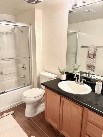 a view of a fountain in front of a house with a big yard