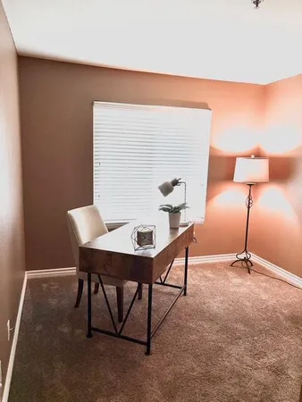 a view of a golf course with a lake