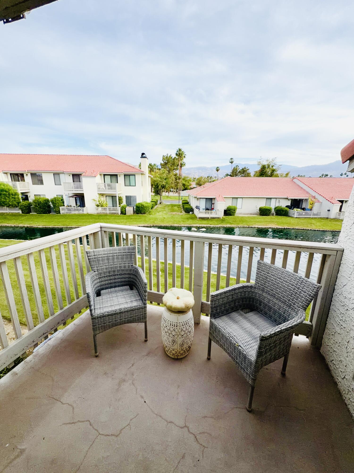 43376 Cook Street, Unit 88 Palm Desert, CA 92211 - Photo 24 of 38 a view of a chairs and table on the terrace