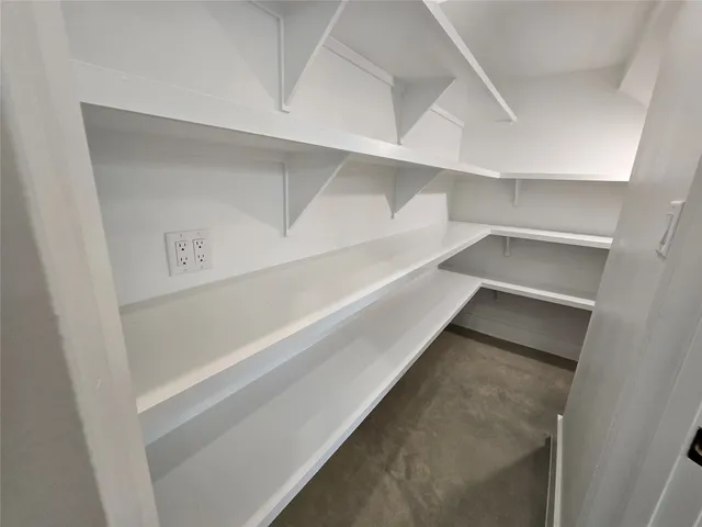 a view of an empty walk in closet