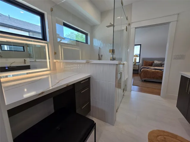 a kitchen with a sink appliances and cabinets