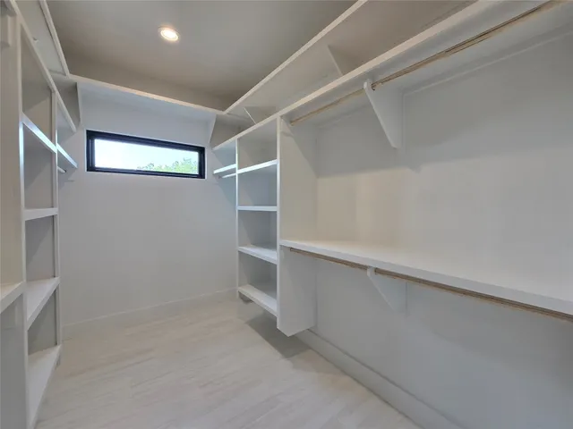 a view of an empty walk in closet