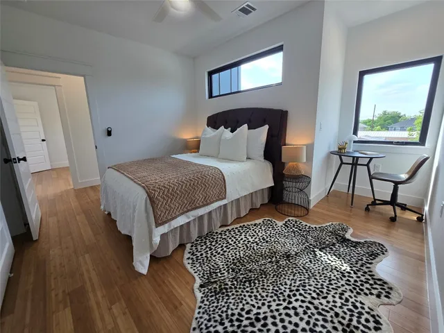 a bedroom with bed and a window