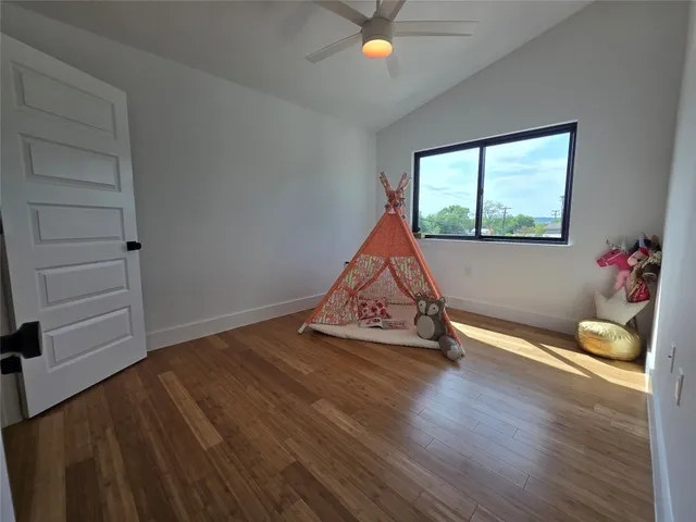 a room with wooden floor and window