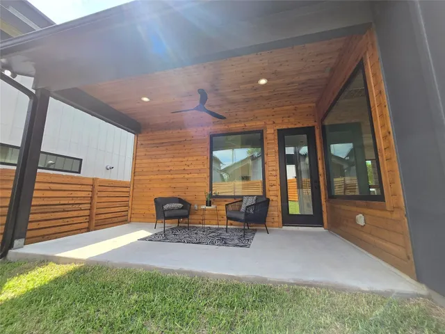 a patio with table and chairs