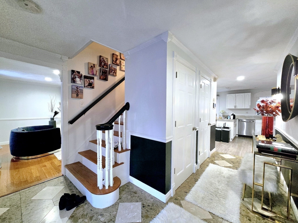 104 West Meadow Road Townsend, MA 01474 - Photo 12 of 42 a living room with furniture and a chandelier
