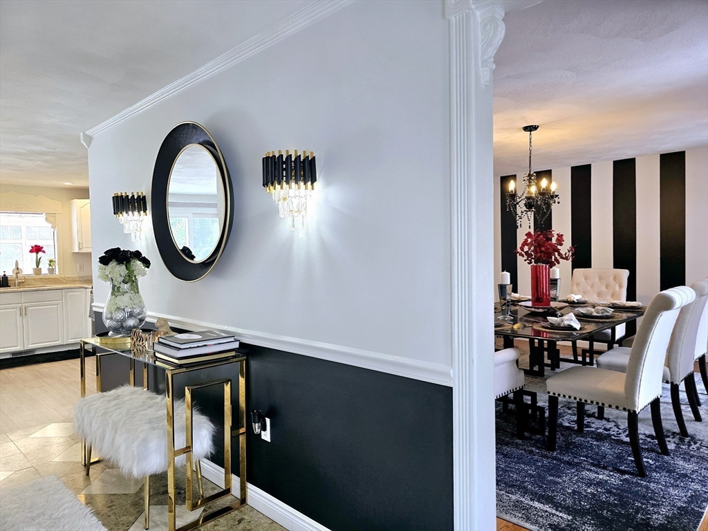 104 West Meadow Road Townsend, MA 01474 - Photo 14 of 42 a view of a dining room with furniture and chandelier