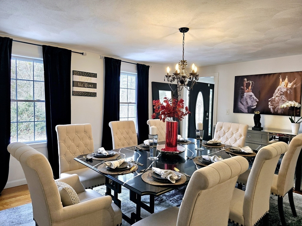 104 West Meadow Road Townsend, MA 01474 - Photo 15 of 42 a work room with furniture a chandelier and a window