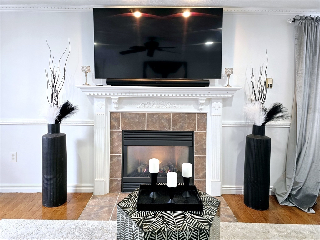 104 West Meadow Road Townsend, MA 01474 - Photo 17 of 42 a living room with furniture and a fireplace
