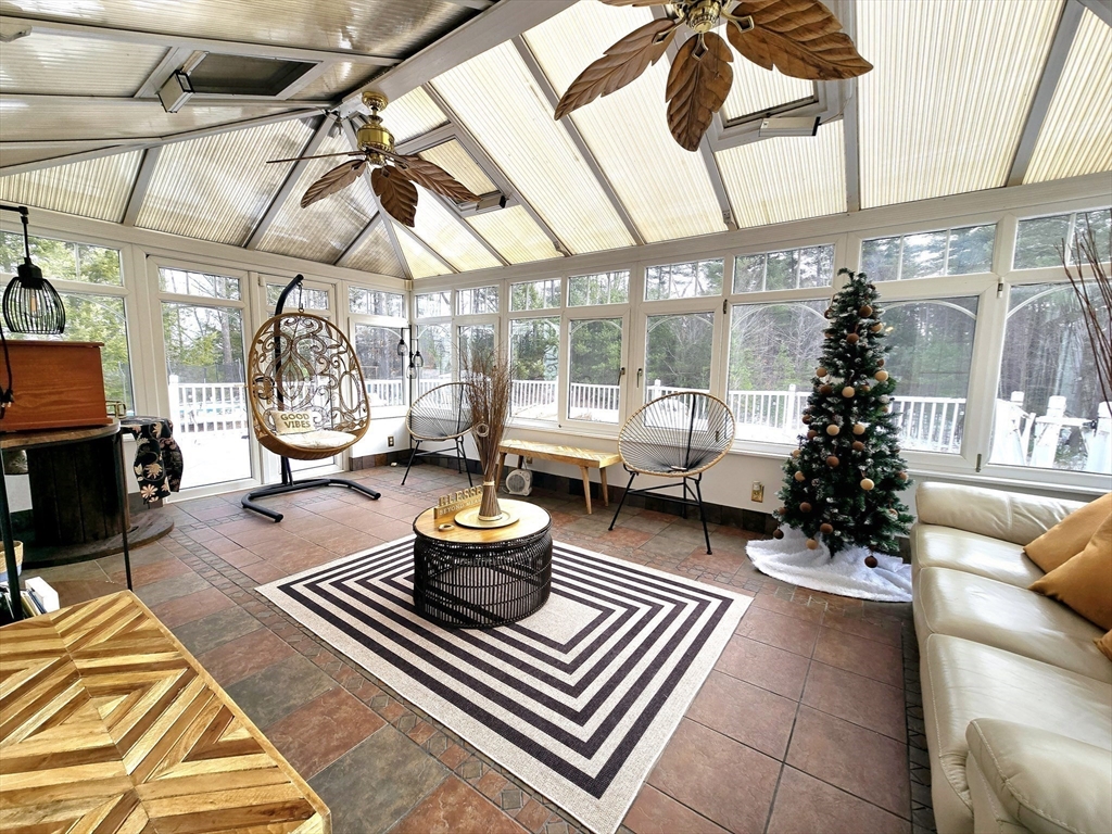 104 West Meadow Road Townsend, MA 01474 - Photo 2 of 42 a living room with furniture and a potted plant