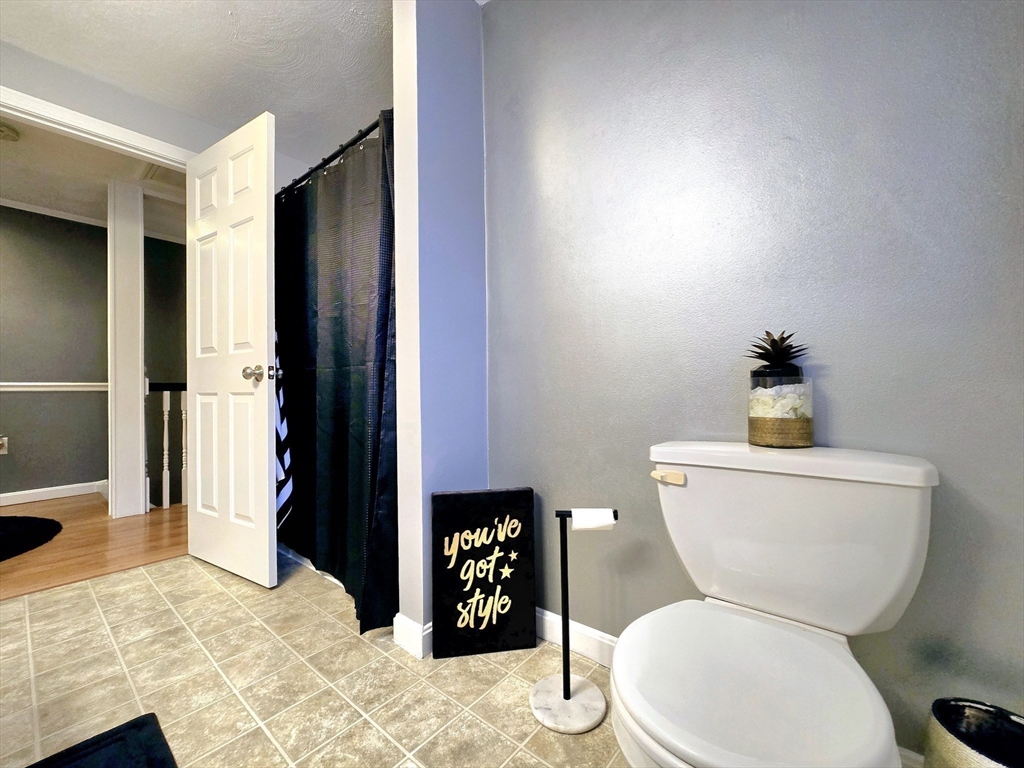 104 West Meadow Road Townsend, MA 01474 - Photo 24 of 42 a white toilet sitting next to a bathroom sink