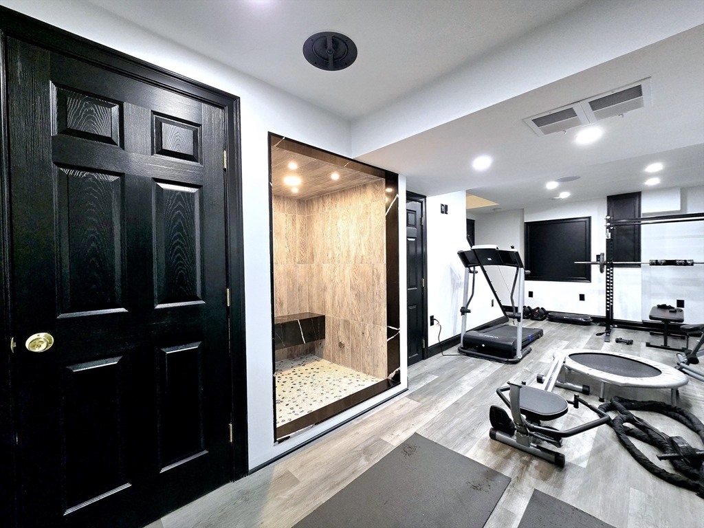 104 West Meadow Road Townsend, MA 01474 - Photo 34 of 42 a room with furniture and a flat screen tv