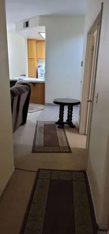 a bedroom with a bed and a night stand