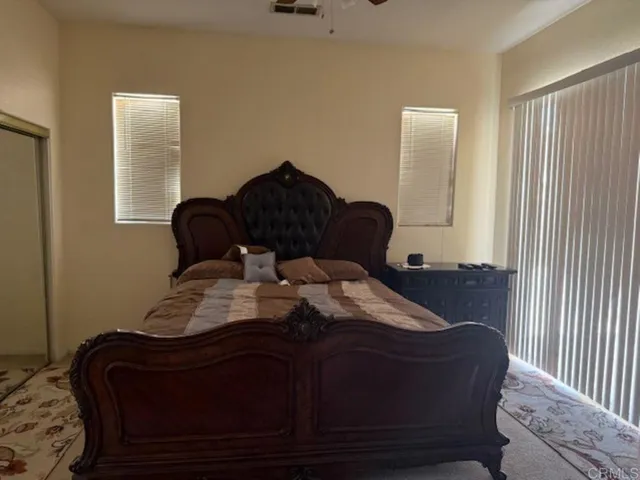 a living room with a rug and a rug