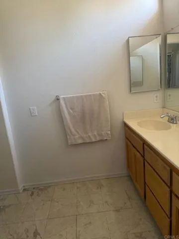 a bathroom with a toilet and a shower curtain