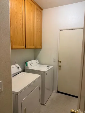 a bedroom with two beds and a couch