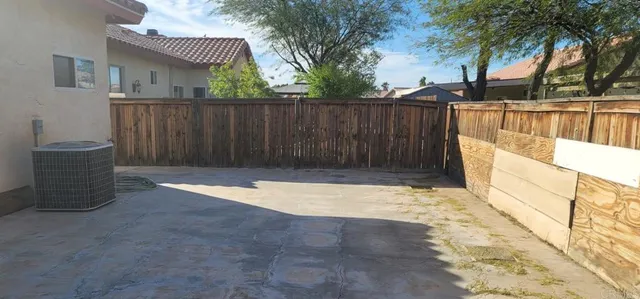 a living room with furniture and a lamp