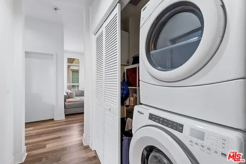 a view of a bedroom with washer and dryer