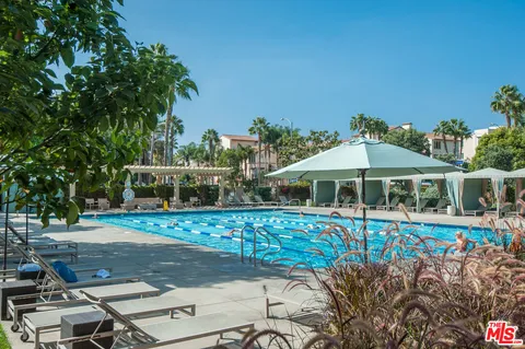a view of a swimming pool with a patio