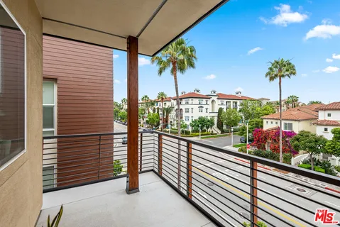 a view of a street from a balcony
