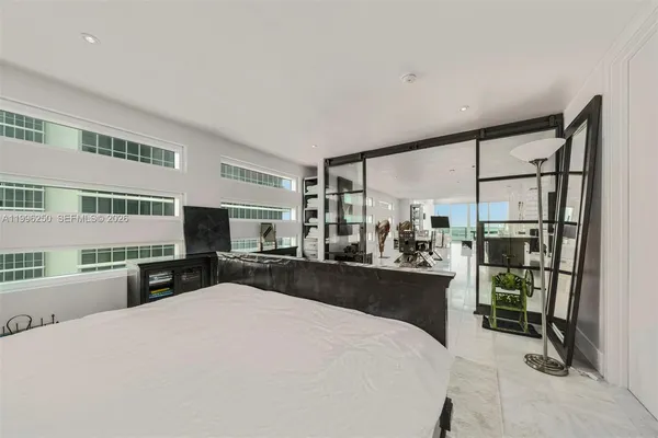 a en suite bathroom with a double vanity sink and a mirror